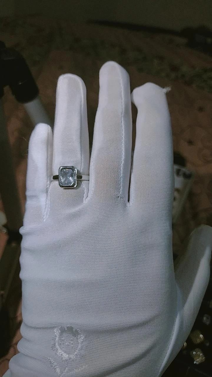 Elegant Emerald-Cut Bezel Solitaire Ring