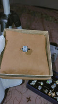Elegant Emerald-Cut Bezel Solitaire Ring